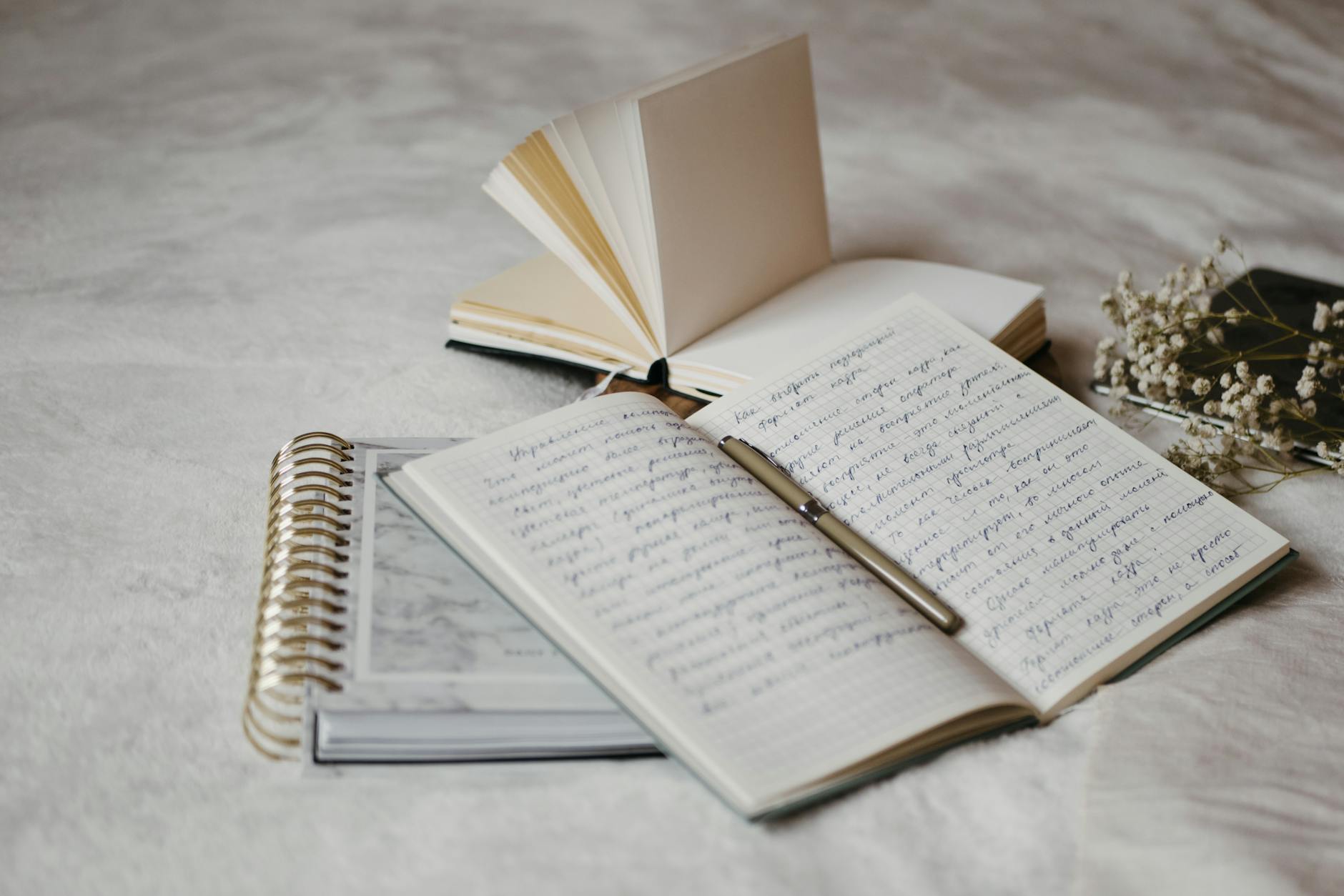 an open notebook with pen