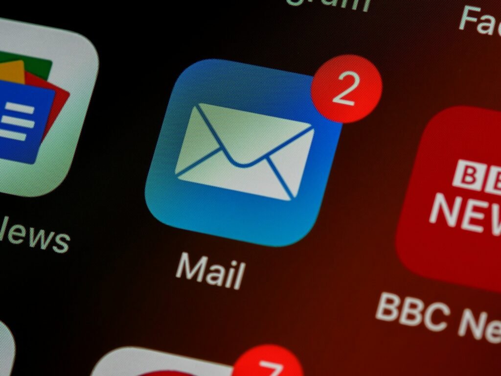 Phone screen showing Mail app notifications while waiting for a professor's reply